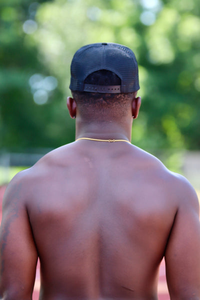BLACK TRUCKER HAT WITH WHITE FONT