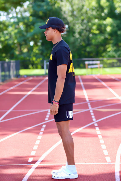 UNDERRATED BLACK T-SHIRT YELLOW SIDE TEXT
